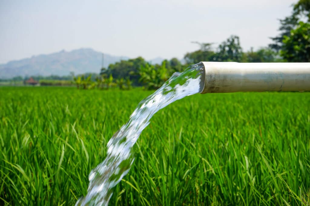 Modern irrigation system watering a vast farmland.